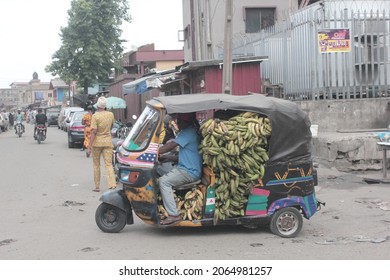 Surulere, Lagos, Nigeria - March 2 2018: Rickshaw Carrying Plantains On A Busy Afternoon. 