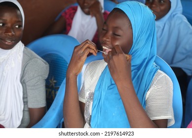 Surulere, Lagos: September 4, 2022-A Female Girl Using Tooth Flux To Clean Her Teeth