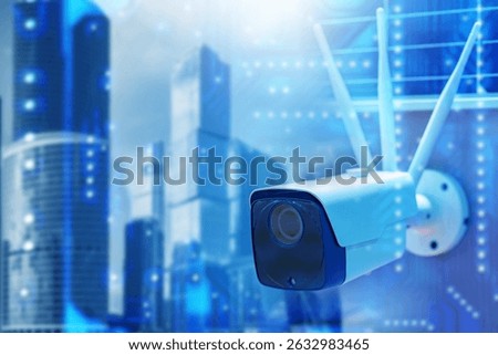 Surveillance camera. CCTV device on wall of building. CCTV system in city. White street camera among skyscrapers. CCTV in downtown. Camera for law enforcement in megapolis. Big brother concept