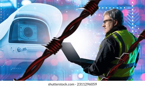 Surveillance camera. Male security engineer. CCTV technology. Surveillance camera installer. Man is holding laptop. Barbed wire near CCTV camera. Security systems. Concept of selling CCTV equipment - Shutterstock ID 2311296059