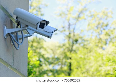 The Surveillance Camera On A Wall Of Building