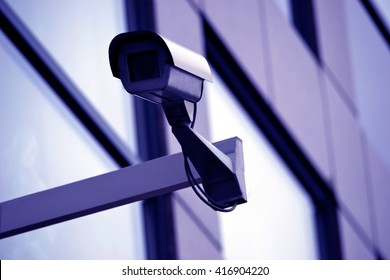 Surveillance, CCTV, security camera installed on a modern building - great for topics like safety, security etc.