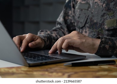 Surveillance And Control Of Opposing Information Concept, Soldier In Camouflage Uniform Working On Laptop For Information Operation.