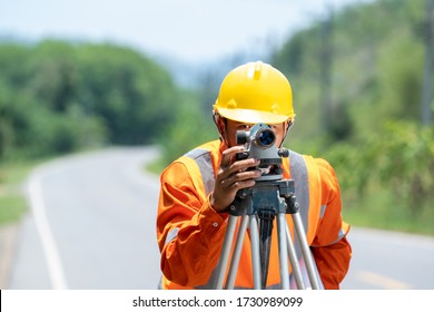 Survey Engineer In Construction Site Use Theodolite Mark At Road.Construction Concept.