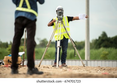 survey engineer in construction site use theodolite mark a concrete pile co ordinate in construction site