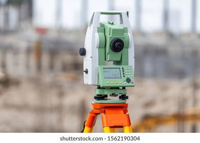 Survey Equipment Theodolite And Total Station At Construction Site.
