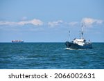 Survey vessel, research vessel patrol boat sailing in bright blue Baltic Sea, navy patrol vessel. Military ship, warship, battleship of Baltic Fleet, Russian Navy