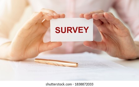 Survey word. Poll or census concept. woman hands over office table.