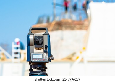 Surveying measuring instrument, Surveyors equipment, Theodolite or total positioning station camera equipment at construction site.