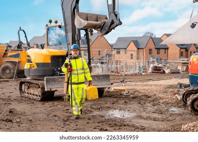 Surveyor builder site engineer with theodolite total station at construction site outdoors during surveying work - Shutterstock ID 2263345959