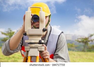 Surveyor engineer making measure in outdoor