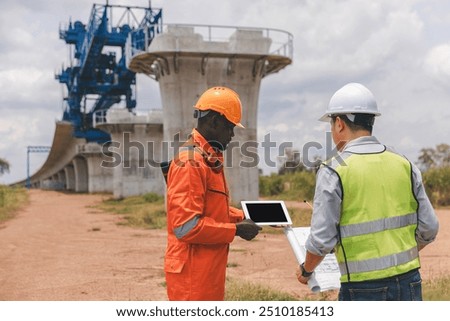 Surveyor engineer worker making measuring with theodolite tool equipment at construction site. Surveyors or explorer view construction sites or check security