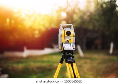 Surveyor Engineering Equipment With Theodolite And Total Station In A Garden