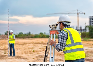 Surveyor Engineering. Surveyor’s telescope at construction site. Surveying for making contour plans are a graphical representation of the lay of the land before startup construction work