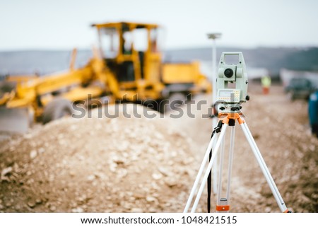 Surveyor equipment GPS system or theodolite outdoors at highway construction site. Surveyor engineering with total station 