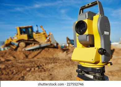 Surveyor equipment tacheometer or theodolite outdoors at construction site 