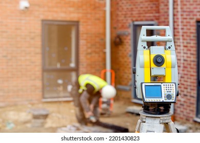 Surveyor optical equipment  tacheometer or theodolite on construction site close-up with selective focus and blurred background