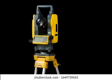 Surveyors Equipment. Theodolite Or Total Positioning Station. Isolated On Black Background