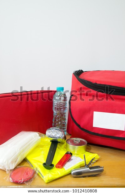 Survival kit for disaster\
release including water, first aid kit, lighter, bags, utility\
knife and others.