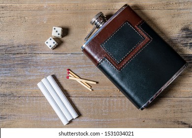 Survival Kit Flat Lay Of Whiskey Flask Cigarettes And Matches