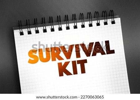 Survival Kit - package of basic tools and supplies prepared as an aid to survival in an emergency, text concept on notepad