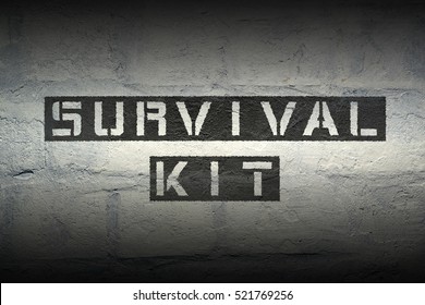 survival kit stencil print on the grunge white brick wall