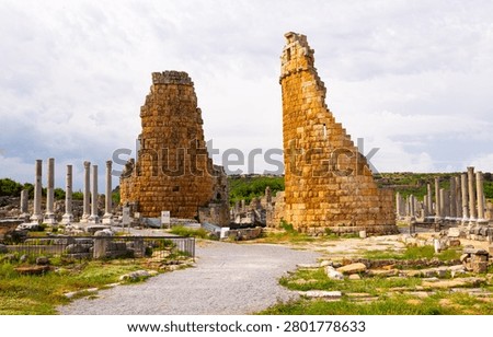 Surviving architectural constructions of Hellenistic gate towers and Corinthian column in ancient Greek city of Perga on territory of modern province of Antalya in Turkey