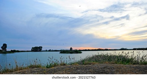 Suset In Doñana. Tarelo Lagoon And Bonanza Marshes. Sanlucar De Barrameda, Andalusia, Spain. National Park Of Doñana Is World Heritage Site By UNESCO And The Largest Ecological Reserve In Europe