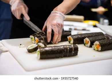 sushi being prepared by the chef in the kitchen