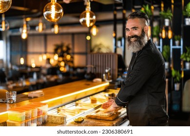 Sushi chef preparing Sushi at sushi restaurant. - Powered by Shutterstock