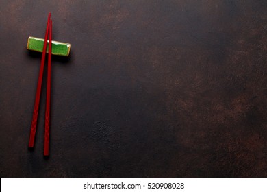 Sushi Chopsticks On Stone Table. Top View With Copy Space