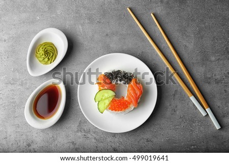Sushi doughnut on grey textured background