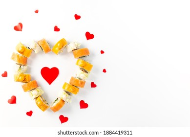Sushi in the form of a heart on a white plate. Valentine's Day. Horizontal orientation, copy space.