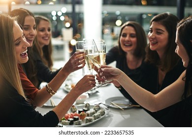 Sushi, friends and restaurant cheers with champagne for birthday celebration or social event. Celebrate toast, happy and smile of women with japanese food eating and drinking together with alcohol - Powered by Shutterstock