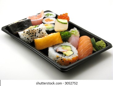 Sushi Lunch With Salmon, Scallop And More In A Box For Takeout, On White.