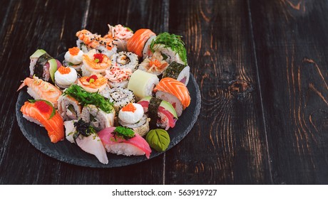 sushi on a black wooden surface