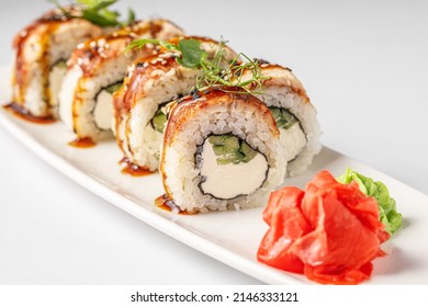 Sushi Roll Close Up, Japanese Food Macro. California Sushi Roll With Tuna, Vegetables And Unagi Sauce Closeup