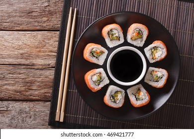 Sushi Roll Philadelphia And Soy Sauce , Closeup On A Plate. Horizontal View From Above
