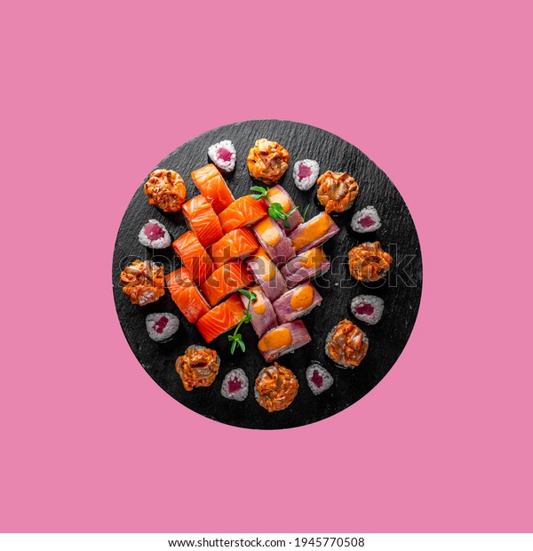 sushi roll in plate on\
pink background