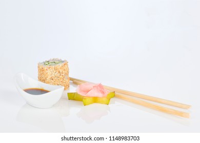 Sushi roll sushi with prawn, avocado, cream cheese, sesame with soy juice. Sushi menu. Japanese food. 