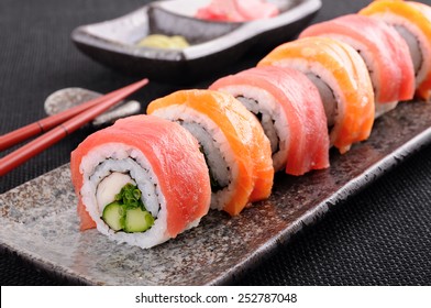 Sushi roll : Row of salmon & tuna sushi rolls with chopsticks