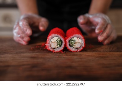 Sushi Roll With Salmon, Avocado, Cucumber And Wasabi On Wooden Board