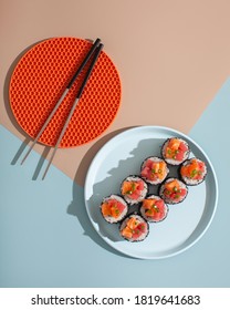 Sushi Roll Top View On Cozy Blue Plate With Chopsticks