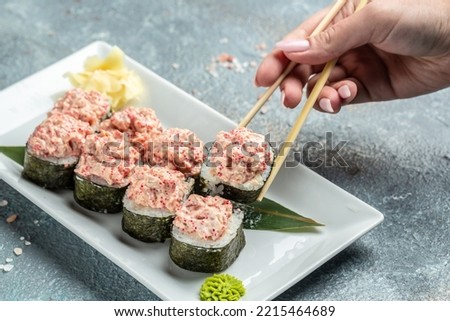 Similar – Image, Stock Photo Delicious sushi rolls on board with chopsticks