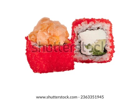 Sushi rolls boned in red artificial caviar on a white background close-up.