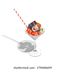 sushi rolls in a martini glass. white background creative concept