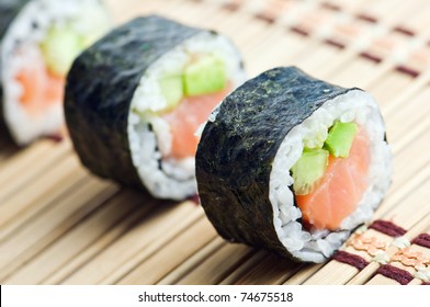 Sushi In Row On Bamboo Mat