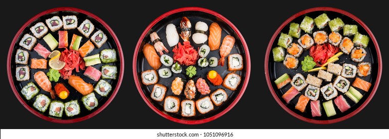 Sushi Set nigiri, rolls and sashimi served in traditional Japan black Sushioke round plate. On dark background - Powered by Shutterstock