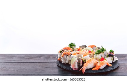 Sushi set on a black wooden background