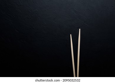 Sushi with tuna salmon rice and chopsticks on an isolated background